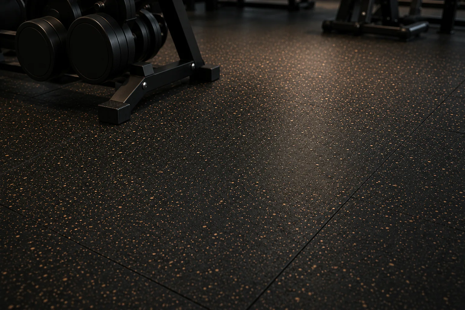 Kettlebell and strength equipment on speckled gym floor tiles